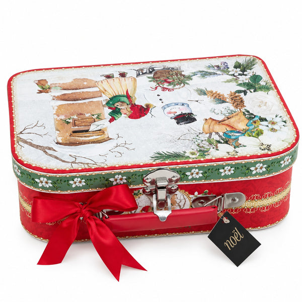 A red rectangular metal gift box with a lid, decorated with a winter holiday scene on the lid, a green floral border, and a large red ribbon bow tied around the front. A black hangtag with the brand name 'noel' is attached.