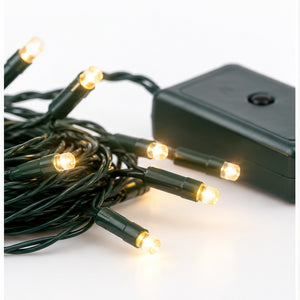 Warm white LED string lights with a black battery box on a white background.