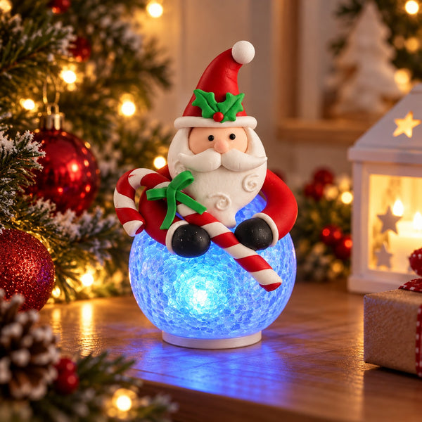 Migros Santa 3-colour changing LED Christmas table light displayed in a cozy festive interior