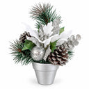 A festive artificial Christmas floral arrangement in a small silver pot, featuring white poinsettia-style flowers, green pine branches, brown pinecones, silver glitter accents, and holly leaves on a white background.