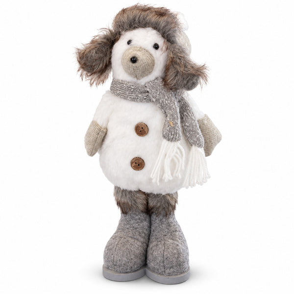 A plush dog doll dressed in winter clothing, featuring a white faux-fur coat with brown buttons, a gray knit scarf, gray knit mittens, and gray knit boots, set against a plain white background.