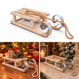 A small wooden sleigh decoration with metal pull loops and rope handle, shown on a white background plus two lifestyle holiday scenes on a wooden floor and countertop with Christmas trees and wrapped gifts.