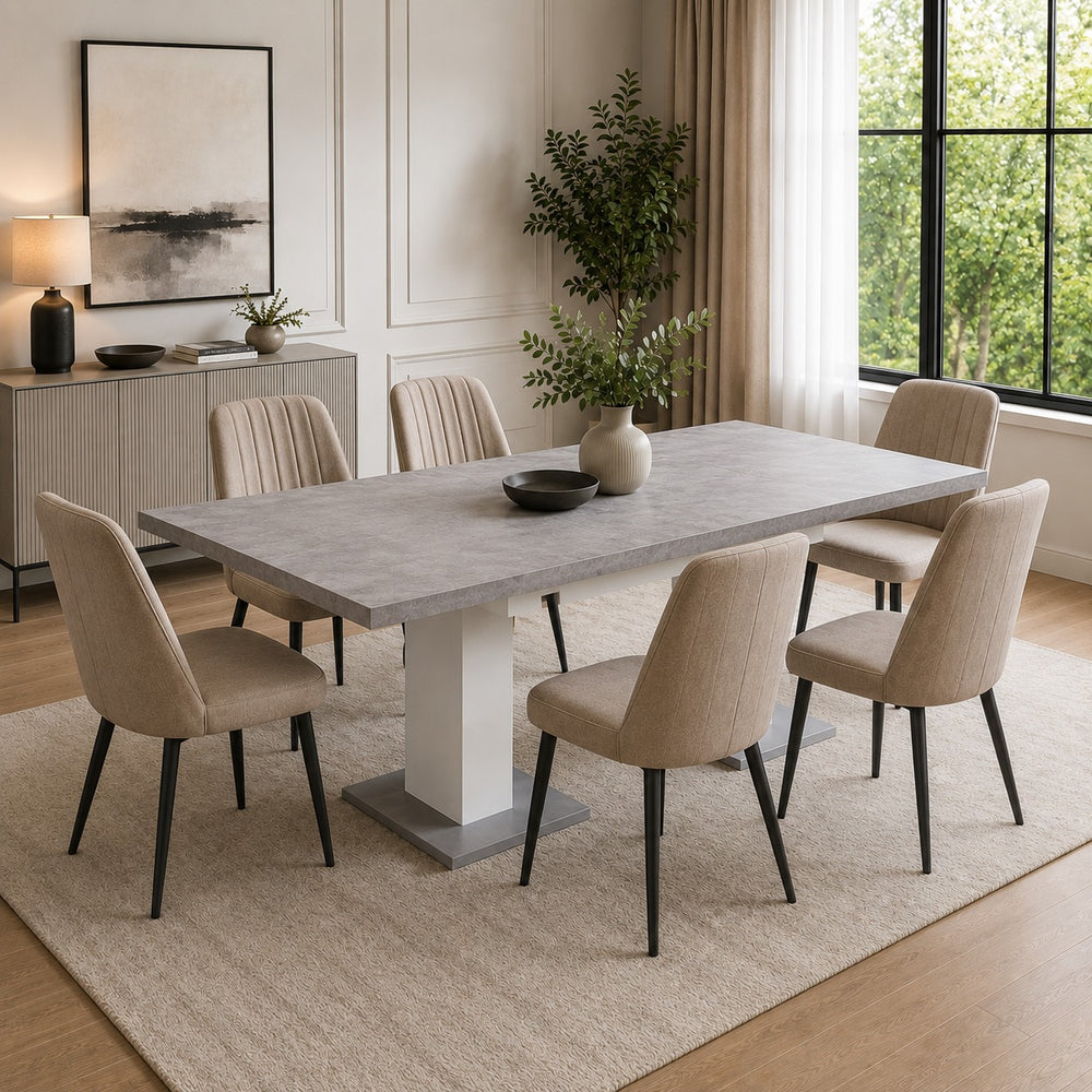 t: Modern dining room featuring a large grey stone-look dining table with six beige upholstered chairs and black legs.