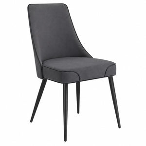 Modern grey upholstered dining chair with black metal legs on a white background.