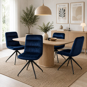 Navy blue velvet dining chairs around a modern dining table