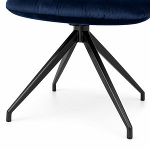 Front view of a modern navy blue velvet swivel dining chair with black metal spider base.