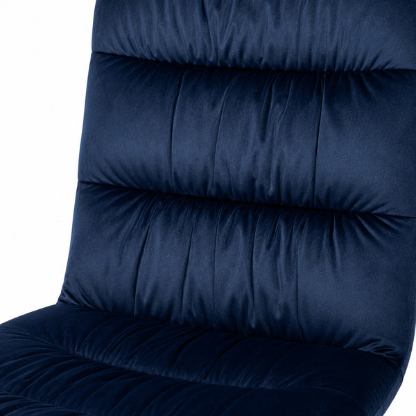 Close-up of the luxurious navy blue velvet upholstery with horizontal channel stitchin