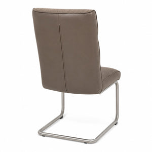 Rear view of the modern taupe cantilever chair showing the leather-look back panel