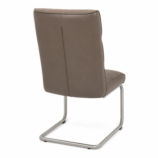 Rear view of the modern taupe cantilever chair showing the leather-look back panel