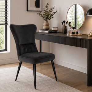 Modern velvet dining chairs in a contemporary bed room.