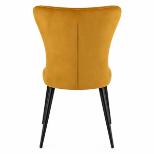 Rear view of the modern wing-back velvet dining chair.