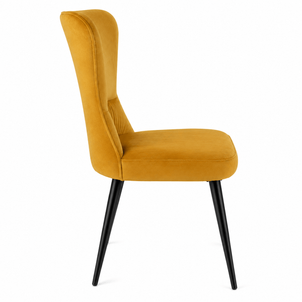 Side profile of the modern upholstered velvet dining chair.