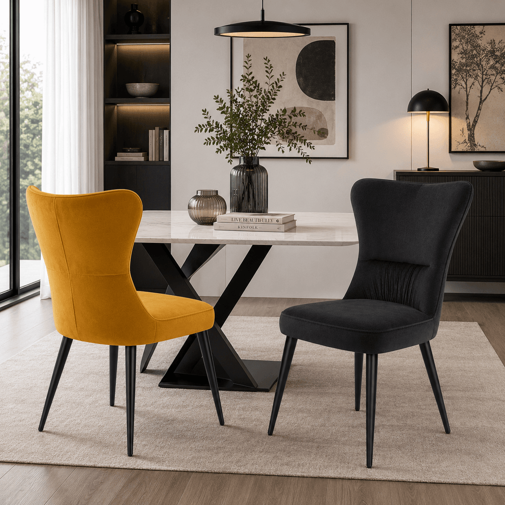 Mustard and Charcoal velvet dining chairs displayed together around a modern dining table.