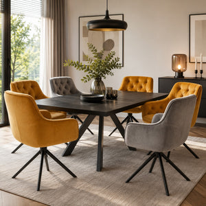 Mustard and grey velvet swivel dining chairs displayed together around a contemporary dining table.