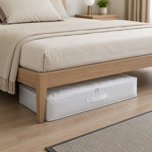 Ordinett Top Class white underbed storage bag neatly placed beneath a modern wooden bed, providing space-saving storage for blankets, bedding, seasonal clothing, and household linens.