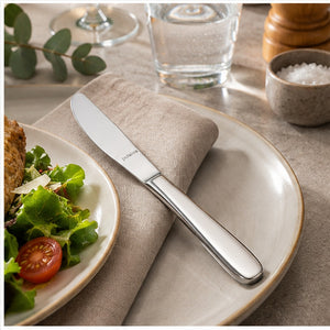 A stainless steel dinner knife with the brand name 'J.A.
