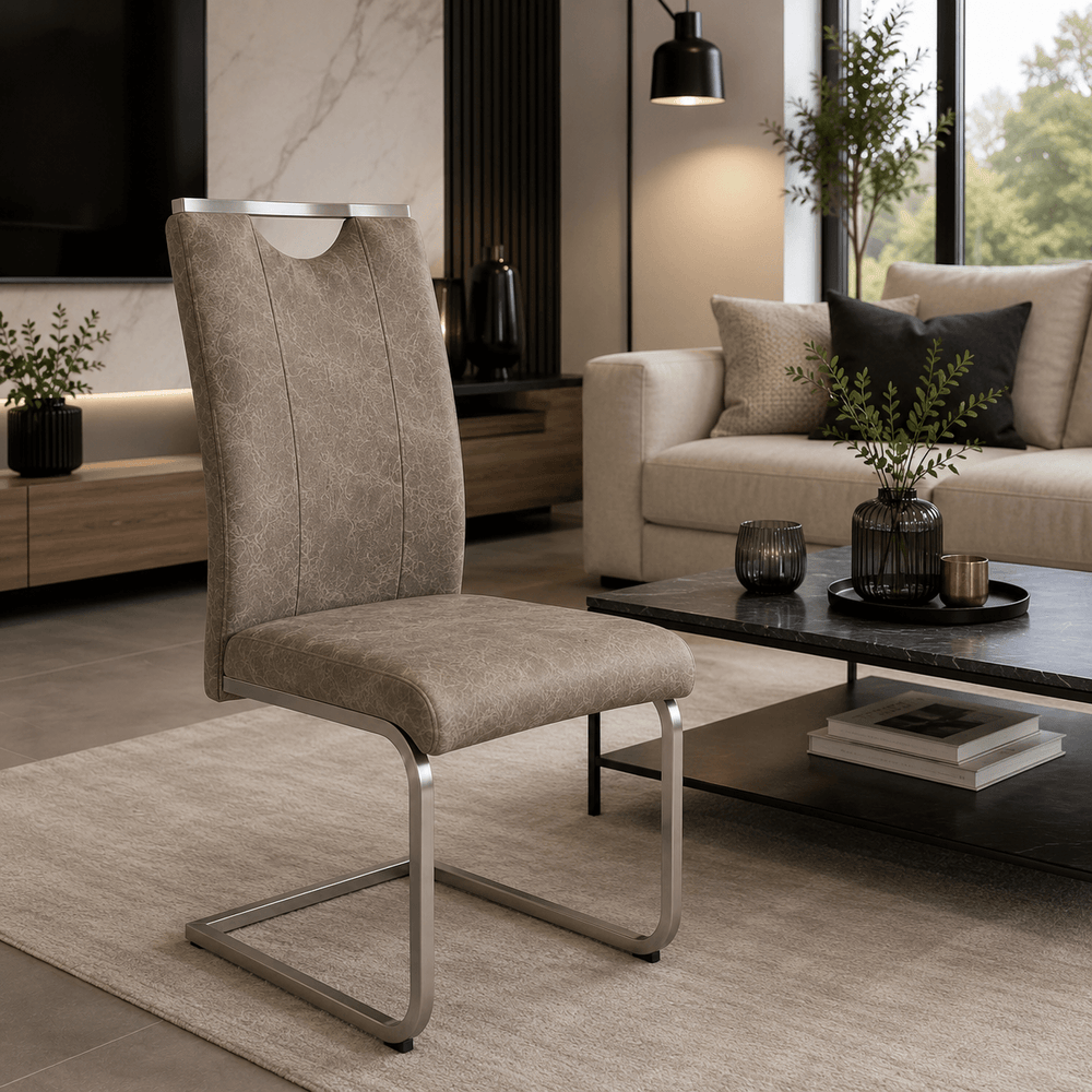Reality Trieste chair displayed beside a coffee table in a modern living room.