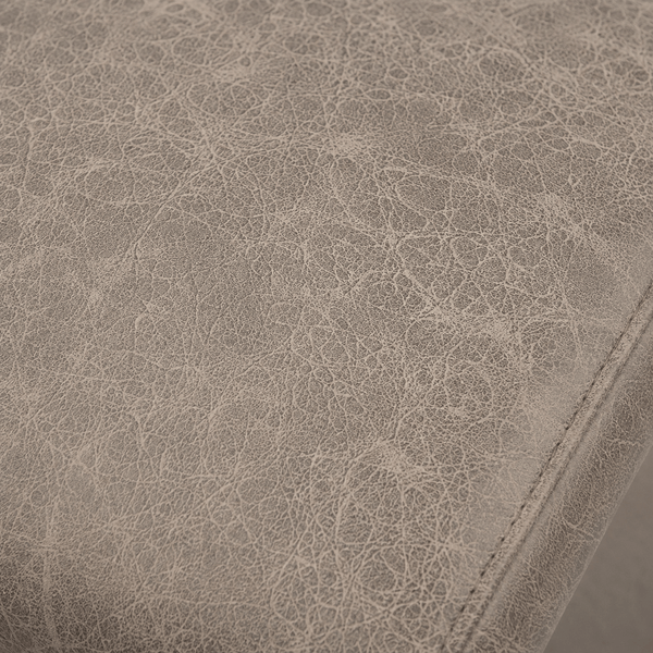 Close-up of the vintage taupe distressed leather-look upholstery texture