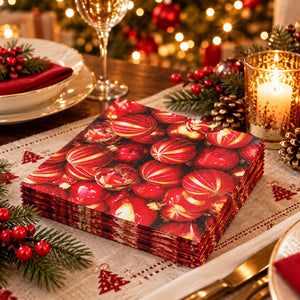 Red and gold Christmas bauble napkins displayed on a festive Christmas dinner table