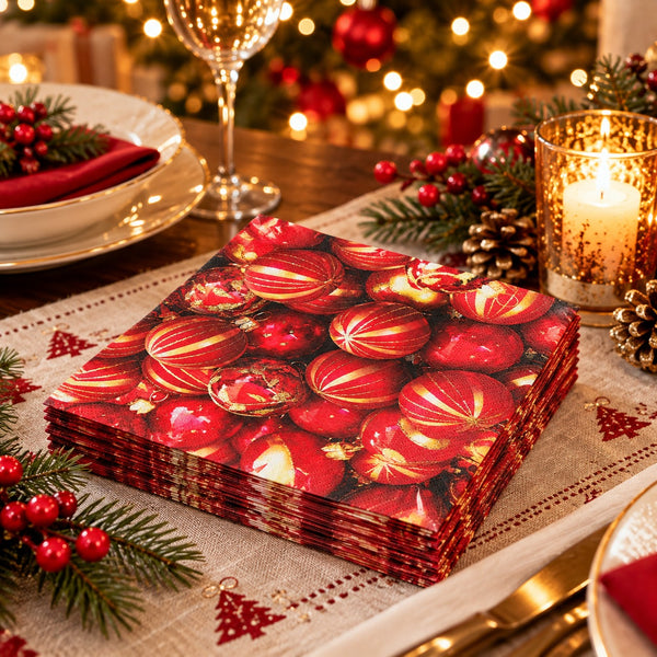 Red and gold Christmas bauble napkins displayed on a festive Christmas dinner table