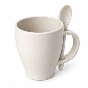 A light beige speckled ceramic mug with a handle shaped like a spoon, shown on a clean white background.