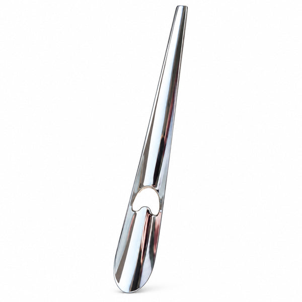 A polished chrome metal bottle opener with a sleek, tapered design and a heart-shaped cutout, shown on a solid white background.