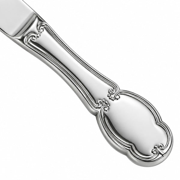 A close-up of a polished silver-toned metal utensil handle with an ornate decorative looped end, shown on a plain white background.